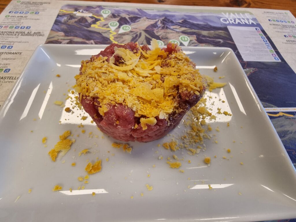 Fassona beef tartare with Castelmagno cheese at Rifugio Fauniera during the Gardetta MTB Tour
