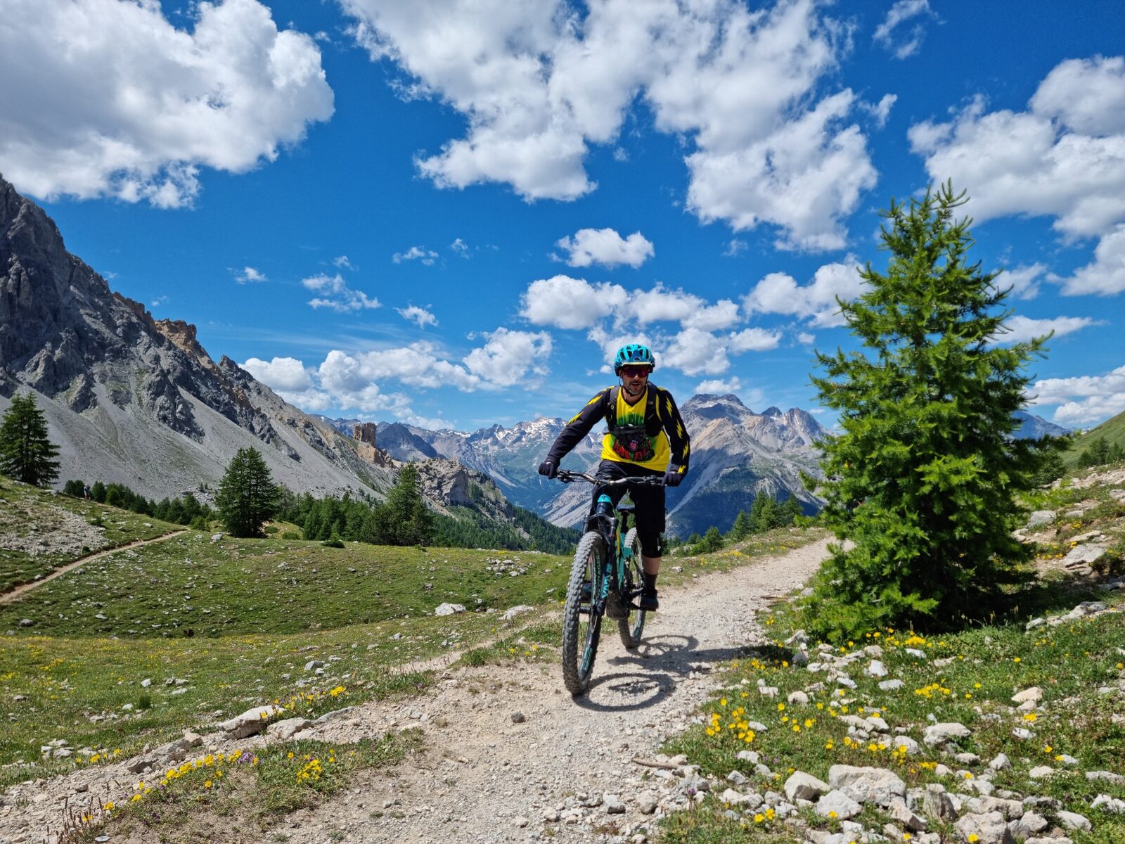 Mountain biker riding a singletrack at Col des Acles