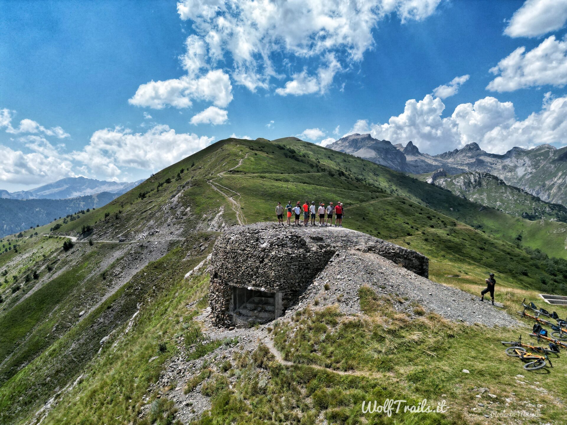 Mountain biker group on an historical military bunker in the maritime alps