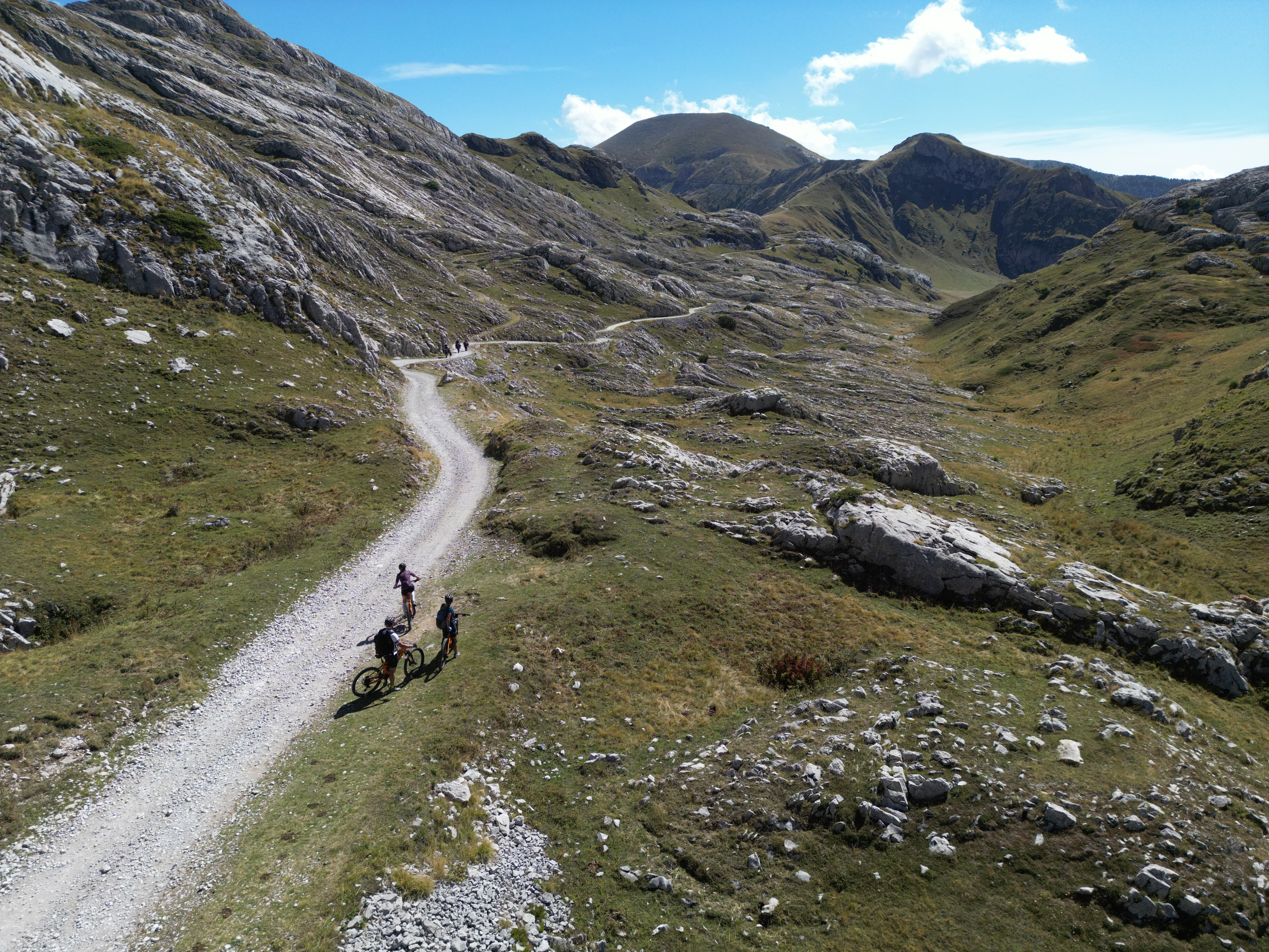 Mountain Bikers riding the Alta Via del Sale in the Western Alps
